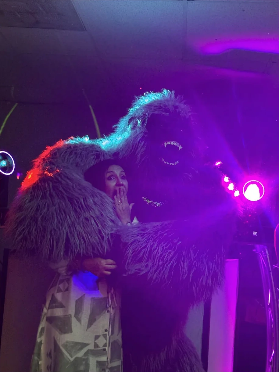 Gorilla Mascot surprising a guest under event lighting